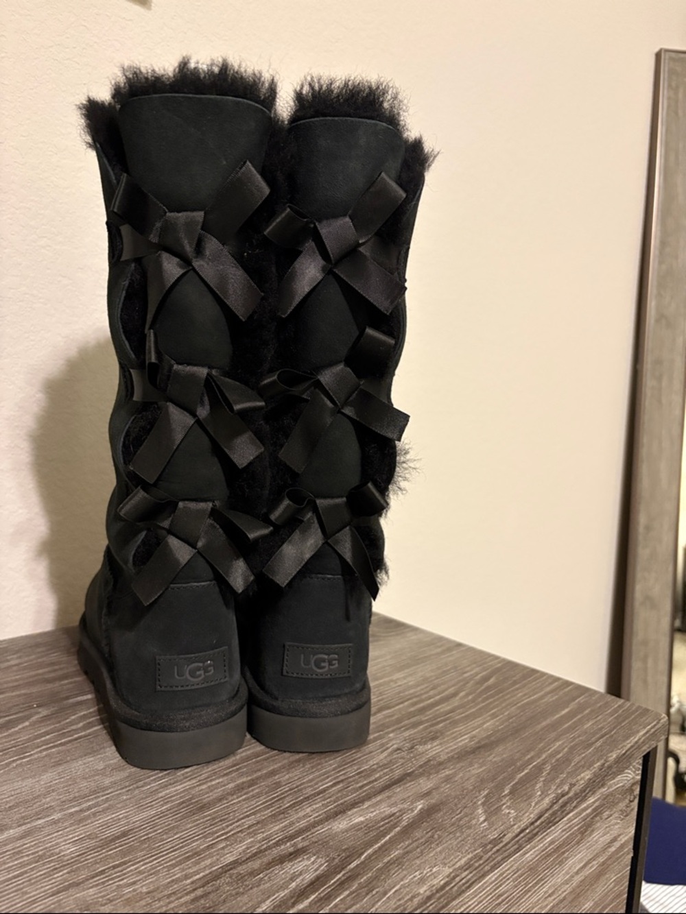 UGG Black Shearling Tall Boots with Satin Bow Accents
